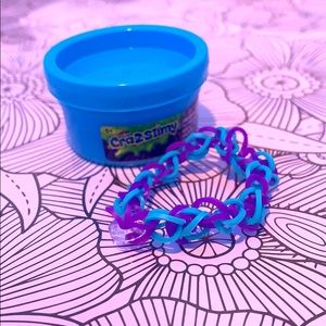 Light blue slime and a cool rainbow loom bracelet